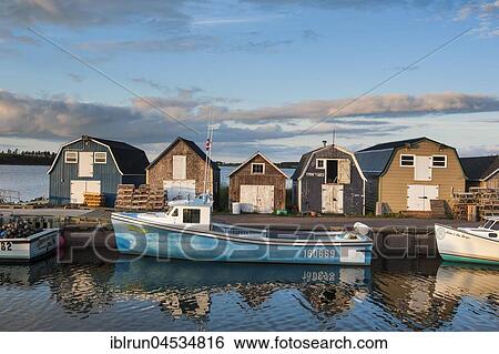 Stock Photograph - Little fishing boat in Stanley Bridge Harbour, Prince Edward Island, Canada, North America. Fotosearch