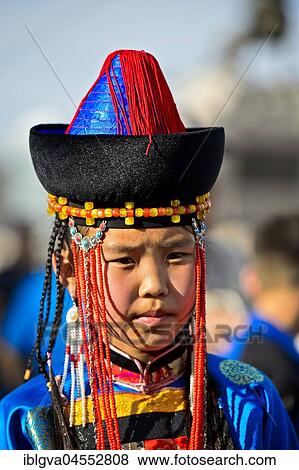 Little girl in traditional Deel clothes and hat with cone-shaped lace, festival of Mongolian National Festival, Ulanbator, Mongolia, Asia View Large Photo Image Stock Photo - Little girl in traditional Deel clothes and hat with cone-shaped lace, festival of Mongolian National Festival, Ulanbator, Mongolia, Asia. Fotosearch