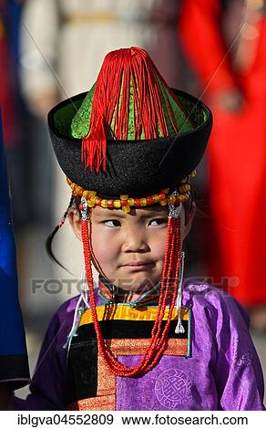 Little girl in traditional Deel clothes and hat with cone-shaped lace, festival of Mongolian National Festival, Ulanbator, Mongolia, Asia View Large Photo Image Stock Photo - Little girl in traditional Deel clothes and hat with cone-shaped lace, festival of Mongolian National Festival, Ulanbator, Mongolia, Asia. Fotosearch