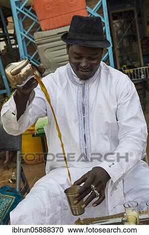 Local man pouring tea, Agadez, Niger, Africa View Large Photo Image Stock Image - Local man pouring tea, Agadez, Niger, Africa. Fotosearch