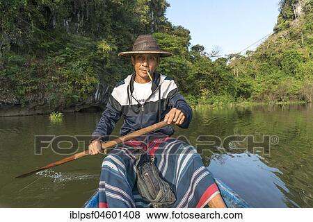 Stock Photo - Local rowers on the lake near Saddan Cave, Hpa-an, Myanmar, Asia. Fotosearch