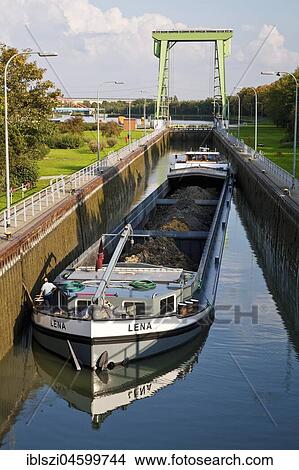 Picture - Lock Friedrichsfeld with cargo ship, Wesel-Datteln-Canal, Voerde, Lower Rhine, Ruhr area, North Rhine-Westphalia, Germany, Europe. Fotosearch