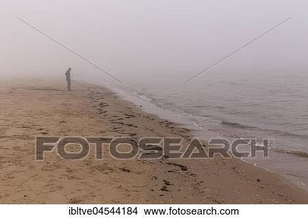 Lonely man on the beach at Mellbystrand, Halland, Sweden, Europe View Large Photo Image Picture - Lonely man on the beach at Mellbystrand, Halland, Sweden, Europe. Fotosearch