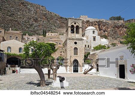 Picture - Main square with bell tower of the Byzantine Greek Orthodox church Christos Elkomenos, lower town, old town, Monemvasia, Lakonia, Peloponnese, Greece, Europe. Fotosearch