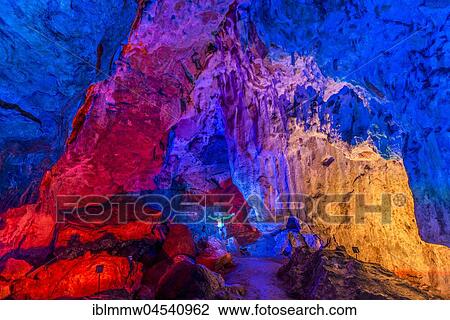 Man in a colourfully illuminated stalactite cave with stalagmites and stalactites, Nebelhöhle, Sonnenbühl, Baden-Württemberg, Germany, Europe View Large Photo Image Stock Image - Man in a colourfully illuminated stalactite cave with stalagmites and stalactites, Nebelhöhle, Sonnenbühl, Baden-Württemberg, Germany, Europe. Fotosearch