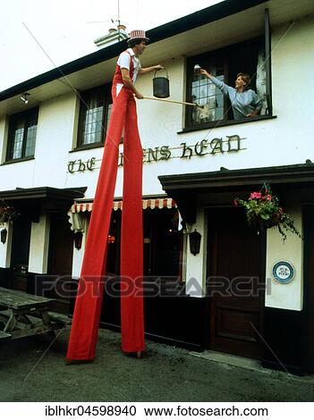 Man on stilts cleaning windows, England, Great Britain View Large Photo Image Stock Image - Man on stilts cleaning windows, England, Great Britain. Fotosearch