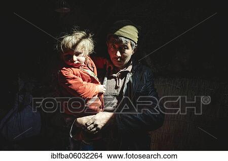 Man with child in his arms, yurt, strong sunlight falling on their faces, Bozai Gumbaz, Wakhan corridor, Badakhshan, Afghanistan, Asia View Large Photo Image Picture - Man with child in his arms, yurt, strong sunlight falling on their faces, Bozai Gumbaz, Wakhan corridor, Badakhshan, Afghanistan, Asia. Fotosearch