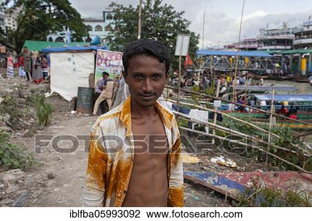 Man with open shirt, behind him river ferries and small boats, Dhaka, Bangladesh, Asia View Large Photo Image Stock Image - Man with open shirt, behind him river ferries and small boats, Dhaka, Bangladesh, Asia. Fotosearch