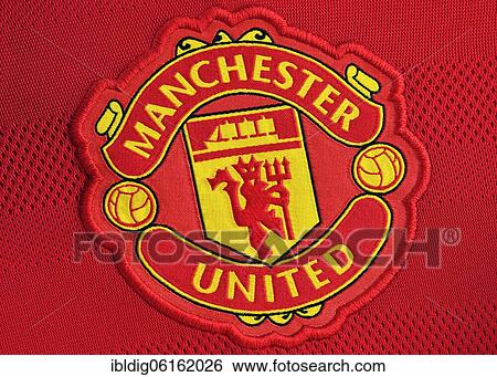 Stock Photograph - Manchester United badge on a football shirt, close up. Fotosearch