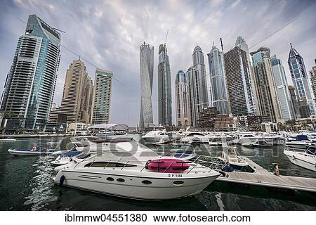 Stock Image - Marina in front of skyscrapers, Dubai Marina, Dubai, United Arab Emirates, Asia. Fotosearch
