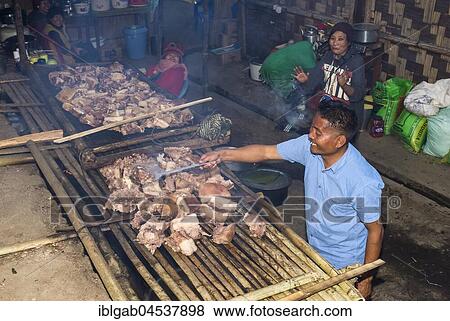 Stock Photo - Meat cooking at the Hornbill Festival, Kohima, Nagaland, India, Asia. Fotosearch