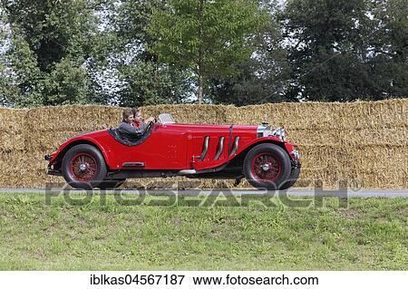 Stock Photo - Merces-Benz SSK on the circuit, sports two-seater from 1928, red, Classic Days Schloss Dyck, Jüchen, North Rhine-Westphalia, Germany, Europe. Fotosearch