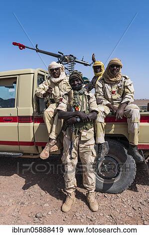 Military escort in the sahel zone near Agadez, Niger, Africa View Large Photo Image Stock Photo - Military escort in the sahel zone near Agadez, Niger, Africa. Fotosearch
