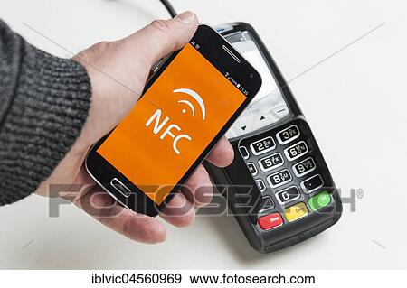 Stock Photo - Mobile payment, pay with the smartphone, pay with NFC, Germany, Europe. Fotosearch