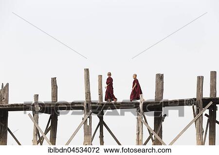 Monks crossing U Bein bridge, Taungthaman Lake, Mandalay region, Myanmar, Asia View Large Photo Image Stock Image - Monks crossing U Bein bridge, Taungthaman Lake, Mandalay region, Myanmar, Asia. Fotosearch