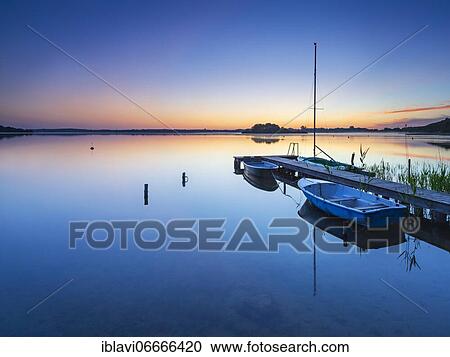 Morning glow at Schaalsee, wooden jetty with boats, Schaalsee Biosphere Reserve, Mecklenburg-Western Pomerania, Germany, Europe View Large Photo Image Stock Image - Morning glow at Schaalsee, wooden jetty with boats, Schaalsee Biosphere Reserve, Mecklenburg-Western Pomerania, Germany, Europe. Fotosearch