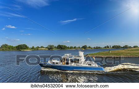 Picture - Motorboat of the water police on the Elbe, near Tangermünde, Saxony-Anhalt, Germany, Europe. Fotosearch