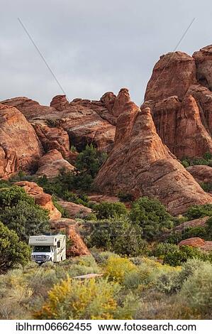 Stock Photography - Motorhome in front of rock scenery, Devils Garden Campground, Arches National Park, Moab, Utah, USA, North America. Fotosearch