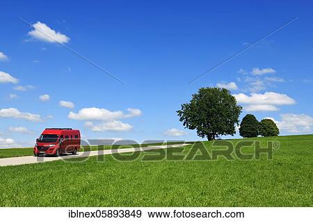 Stock Photo - Motorhome on picture book country road near Berg, Starnberger See, Upper Bavaria, Bavaria, Germany, Europe. Fotosearch
