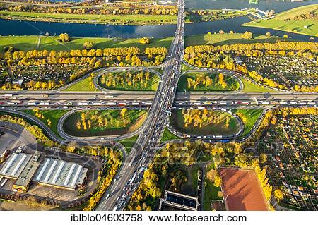 Stock Photo - Motorway intersection Kleeblatt, A40 and A59 to rush hour, traffic jam on the A40 near Duisburg, Kleingärten, Ruhrdeich, Duisburg, Ruhr Area, North Rhine-Westphalia, Germany, Europe. Fotosearch