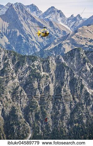 Mountain rescue by helicopter on the Fellhorn ridge, Kleinwalsertal, Riezlern, Vorarlberg, Austria, Europe View Large Photo Image Stock Photo - Mountain rescue by helicopter on the Fellhorn ridge, Kleinwalsertal, Riezlern, Vorarlberg, Austria, Europe. Fotosearch
