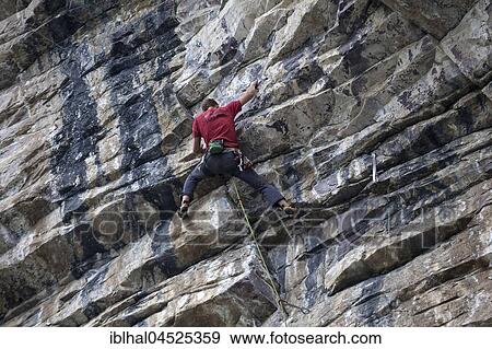 Stock Photo - Mountaineer, climber in a steep face, Banff National Park, Rocky Mountains, Alberta, Canada, North America. Fotosearch