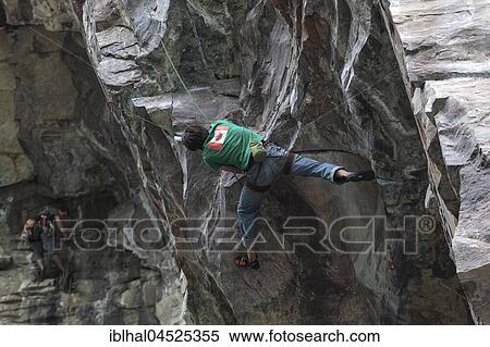 Stock Photography - Mountaineers, climbers in a steep face, Banff National Park, Rocky Mountains, Alberta, Canada, North America. Fotosearch
