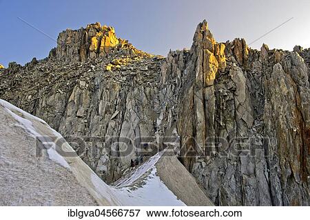Mountaineers descending from the Cold du Tour mountain pass towards glacier Glacier du Tour, evening light, Chamonix, Savoy, France, Europe View Large Photo Image Stock Photo - Mountaineers descending from the Cold du Tour mountain pass towards glacier Glacier du Tour, evening light, Chamonix, Savoy, France, Europe. Fotosearch