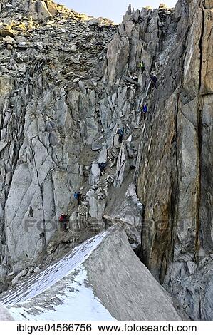 Mountaineers descending from the Cold du Tour mountain pass towards Glacier du Tour, Chamonix, Savoy, France, Europe View Large Photo Image Stock Photograph - Mountaineers descending from the Cold du Tour mountain pass towards Glacier du Tour, Chamonix, Savoy, France, Europe. Fotosearch