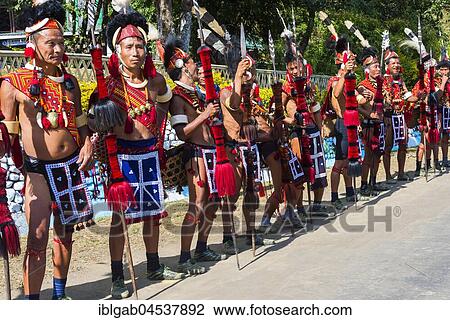 Naga tribal group performers standing in line to welcome the officials at the Hornbill Festival, Kohima, Nagaland, India, Asia View Large Photo Image Stock Image - Naga tribal group performers standing in line to welcome the officials at the Hornbill Festival, Kohima, Nagaland, India, Asia. Fotosearch