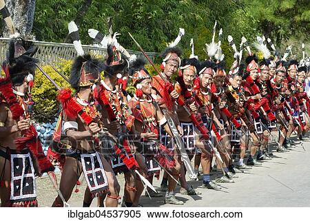 Stock Photography - Naga tribal group performers standing in line to welcome Officials at the Hornbill Festival, Kohima, Nagaland, India, Asia. Fotosearch