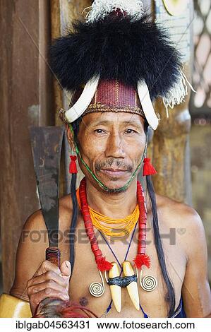 Stock Image - Naga tribal man in traditional outfit, Kisima Nagaland Hornbill festival, Kohima, Nagaland, India, Asia. Fotosearch