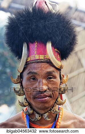 Stock Image - Naga tribal man in traditional outfit, Kisima Nagaland Hornbill festival, Kohima, Nagaland, India, Asia. Fotosearch