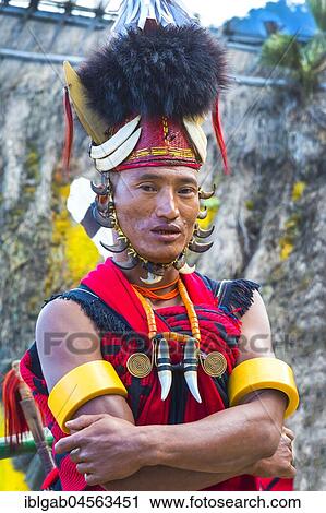 Stock Image - Naga tribal man in traditional outfit, Kisima Nagaland Hornbill festival, Kohima, Nagaland, India, Asia. Fotosearch