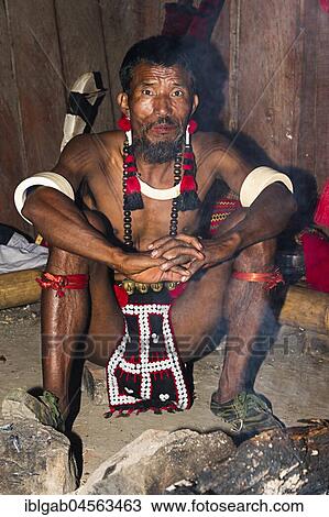 Stock Image - Naga tribal man in traditional outfit, Kisima Nagaland Hornbill festival, Kohima, Nagaland, India, Asia. Fotosearch