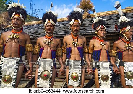 Picture - Naga tribal men in traditional clothing performing ritual dances, Kisima Nagaland Hornbill festival, Kohima, Nagaland, India, Asia. Fotosearch
