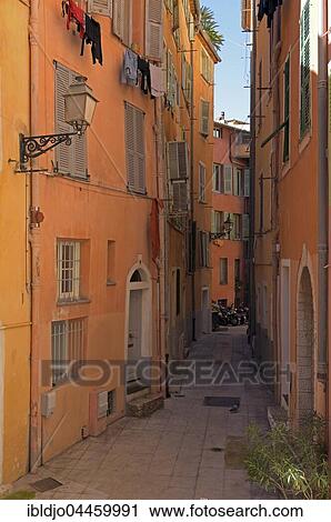 Narrow alley with colorful facades, Nice, Provence-Alpes-Côte d'Azur, France, Europe View Large Photo Image Stock Image - Narrow alley with colorful facades, Nice, Provence-Alpes-Côte d'Azur, France, Europe. Fotosearch