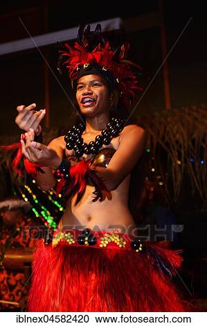 Stock Image - Native people at dance performance, cultural show in Highland Paradise Cultural Centre, Rarotonga, Cook Islands, Oceania. Fotosearch