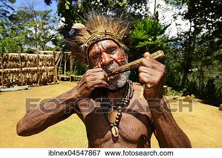 Stock Photo - Native people, Simbu tribe, with wind instrument, Hagareto Village, Goroka, Highlands of Papua New Guinea, Oceania. Fotosearch