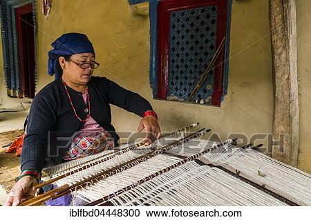 Native woman weaving blanket using sheep's wool in front of house, Ghandruk, Kaski District, Nepal, Asia View Large Photo Image Stock Image - Native woman weaving blanket using sheep's wool in front of house, Ghandruk, Kaski District, Nepal, Asia. Fotosearch