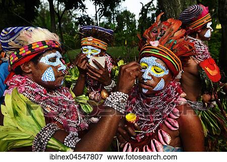 Stock Photo - Natives paint themselves, Marowa Welda Group, Highland Tribe, Sing-Sing Festival, Goroka, Papua New Guinea, Oceania. Fotosearch