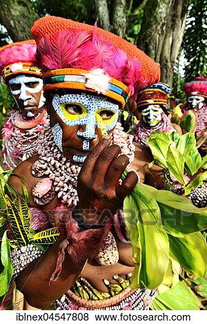 Stock Photo - Natives paint themselves, Marowa Welda Group, Highland Tribe, Sing-Sing Festival, Goroka, Papua New Guinea, Oceania. Fotosearch