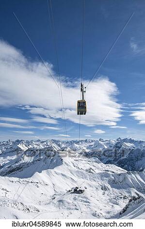 Nebelhorn cable car in front of snow-covered alpine panorama, Nebelhorn, Kleinwalsertal, Oberstdorf, Vorarlberg, Austria, Europe View Large Photo Image Stock Photography - Nebelhorn cable car in front of snow-covered alpine panorama, Nebelhorn, Kleinwalsertal, Oberstdorf, Vorarlberg, Austria, Europe. Fotosearch