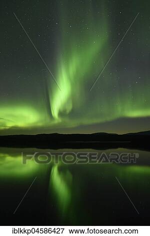 Northern lights reflected in a lake in the Abisko National Park, Sweden, Europe View Large Photo Image Stock Photo - Northern lights reflected in a lake in the Abisko National Park, Sweden, Europe. Fotosearch