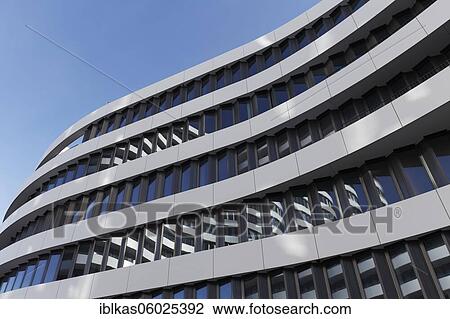 Stock Image - Office building with curved facade by SOP Architekten, headquarters of the hotel search engine Trivago, Trivago Campus, Medienhafen Düsseldorf, North Rhine-Westphalia, Germany, Europe. Fotosearch