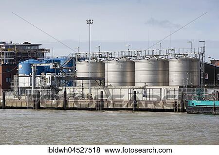 Stock Photo - Oil tanks by the harbor, Cuxhaven, North Sea, Lower Saxony, Germany, Europe. Fotosearch