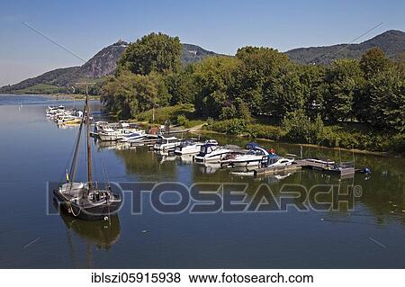 Old Rhine with Aalschokker Aranka, marina and Drachenfels with Siebengebirge, Bad Honnef, North Rhine-Westphalia, Germany, Europe View Large Photo Image Stock Photo - Old Rhine with Aalschokker Aranka, marina and Drachenfels with Siebengebirge, Bad Honnef, North Rhine-Westphalia, Germany, Europe. Fotosearch