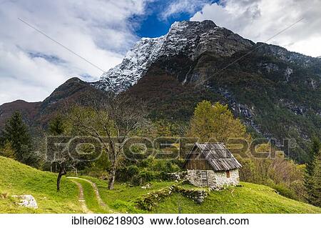 Stock Image - Old stone house near Bovec, Slovenia, Europe. Fotosearch