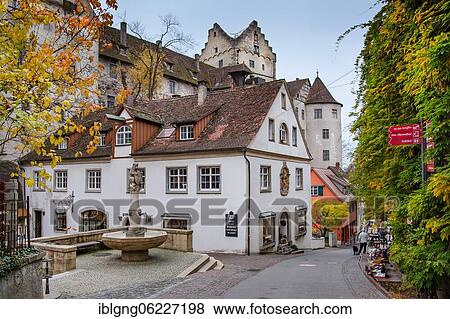 Stock Photo - Old town alley with fountain and the castle Meersburg, Meersburg, Lake Constance, Upper Swabian Baroque Street, Baden-Württemberg, Germany, Europe. Fotosearch