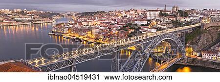 Stock Image - Old town with bridge, arched bridge Ponte Dom Luís I over the Douro, dawn, Porto, Portugal, Europe. Fotosearch
